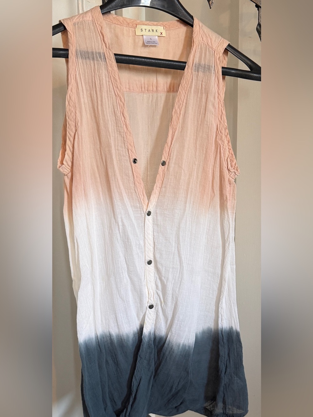 Sleeveless, thin, multi colored, cotton blouse.